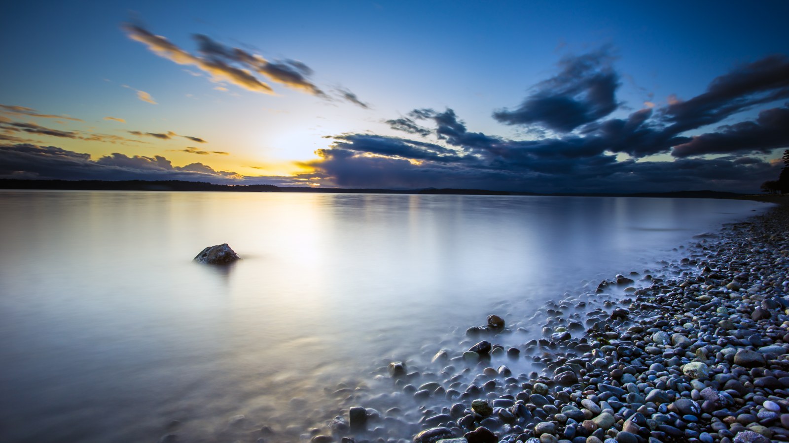 Pebble Shore at Sunset 4K Wallpaper — Nature wallpaper