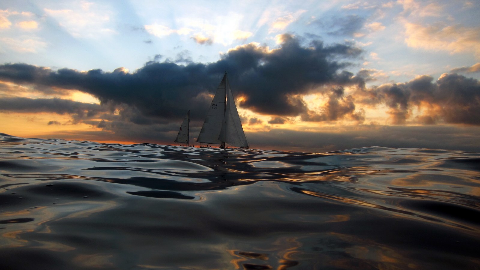 Sailboats on a Dramatic Sea 4K Wallpaper — Nature wallpaper