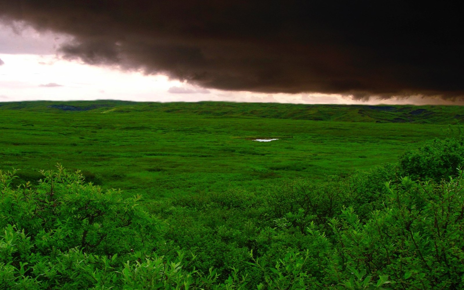 Storm Clouds Above Green Hills Wallpaper — Nature wallpaper