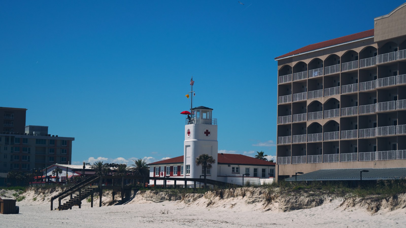 Beachfront Tower Under a Blue Sky — Ocean & Beach wallpaper