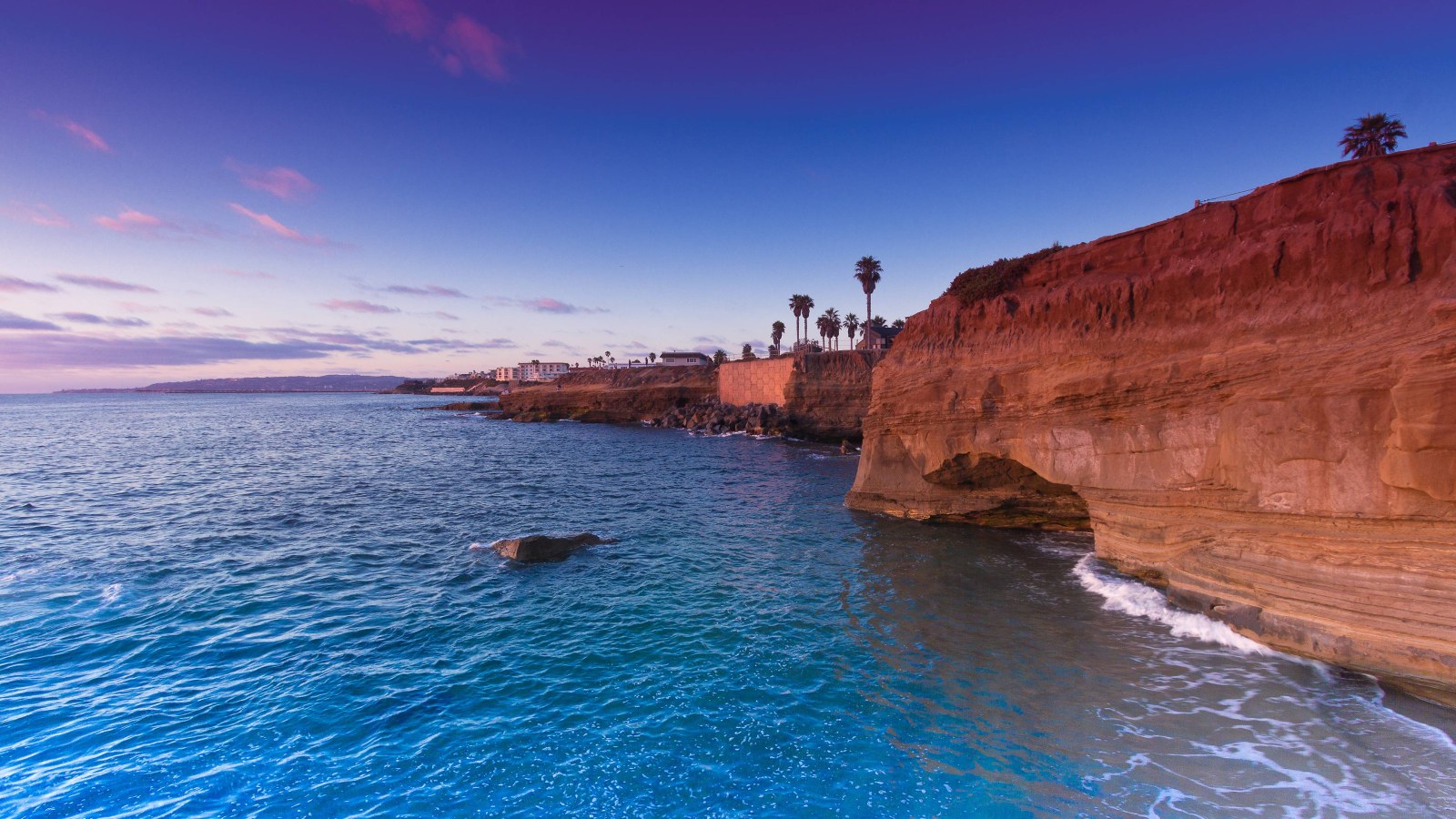 Red Coastal Cliffs and Blue Sea 4K Wallpaper — Nature wallpaper