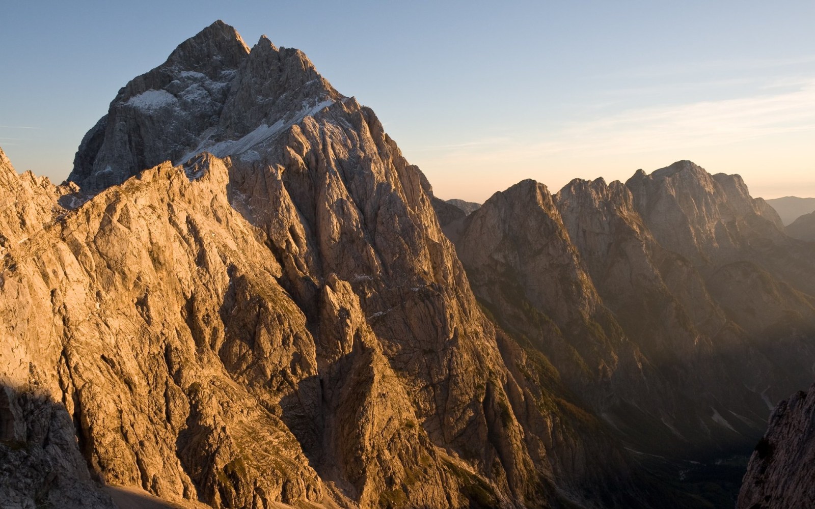 Golden Light on Rugged Mountain Peaks Wallpaper — Nature wallpaper
