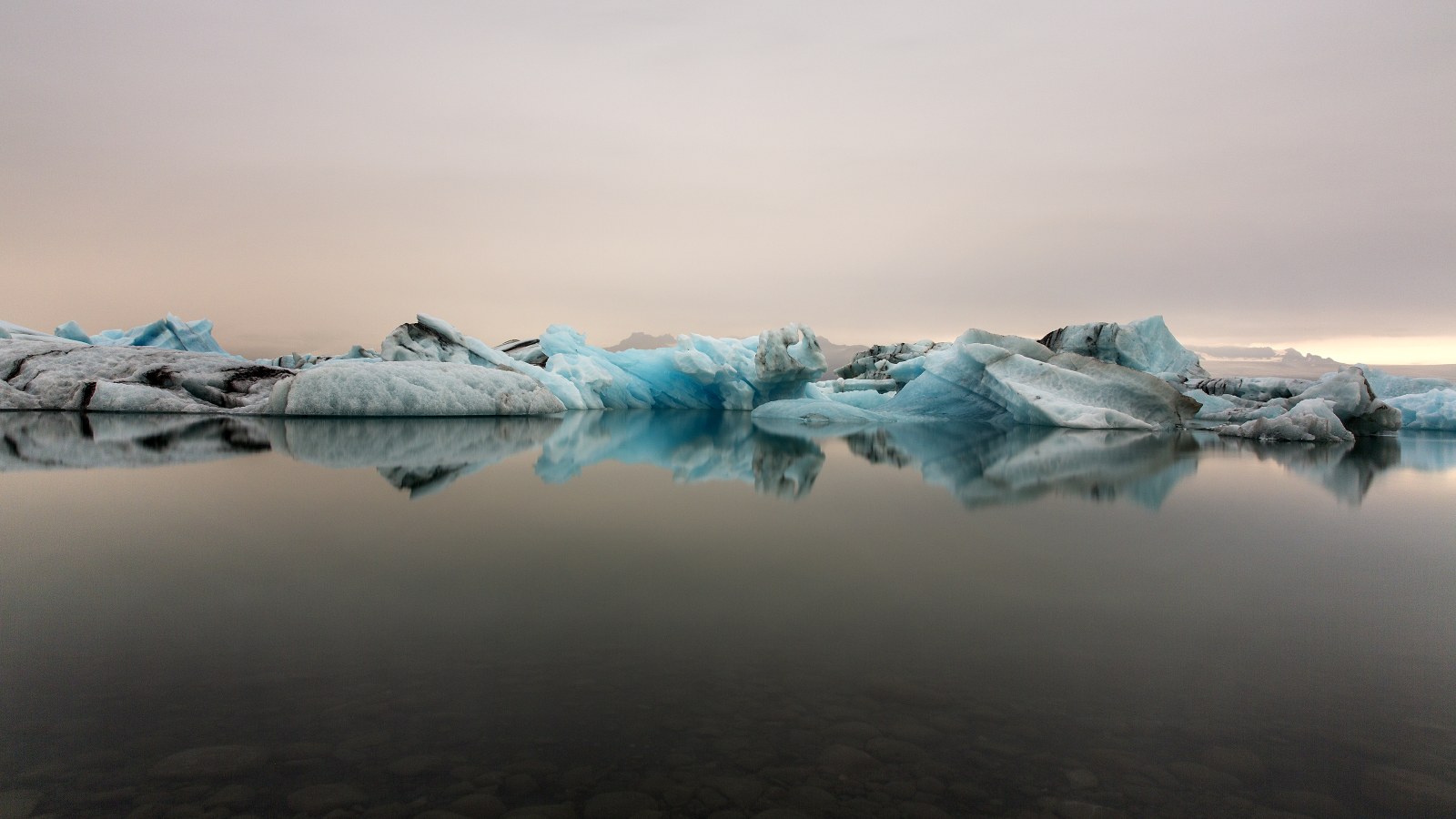 Icebergs Reflected in a Calm Lagoon 4K Wallpaper — Nature wallpaper
