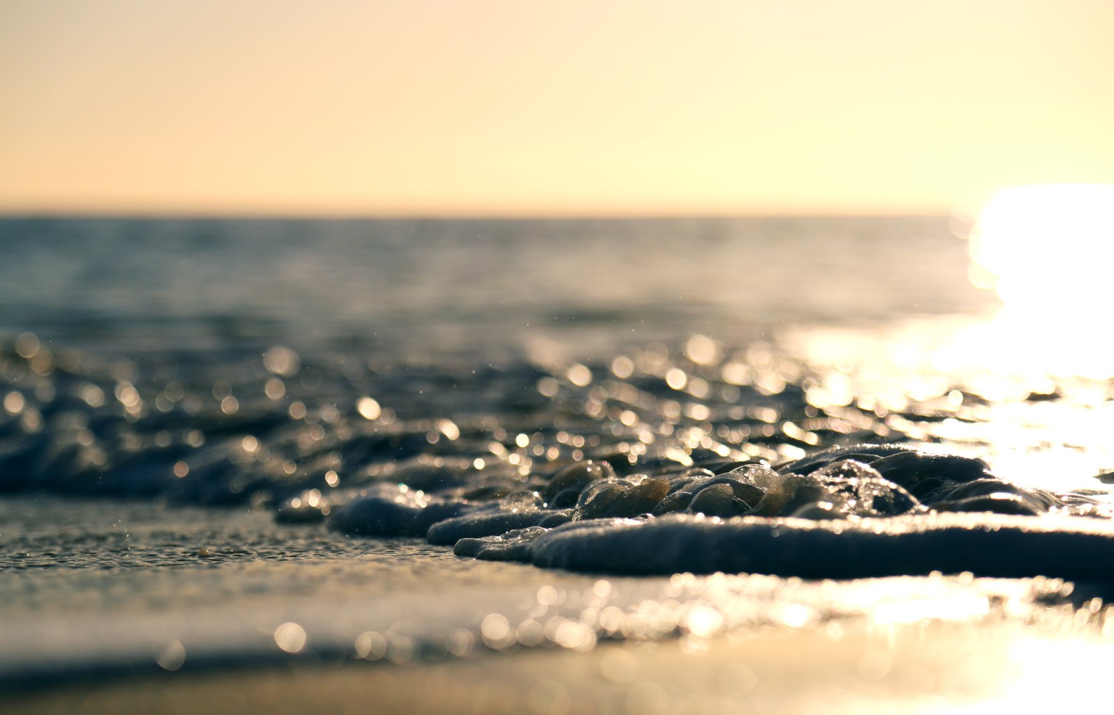 Sunset Over a Pebble Beach — Ocean & Beach wallpaper