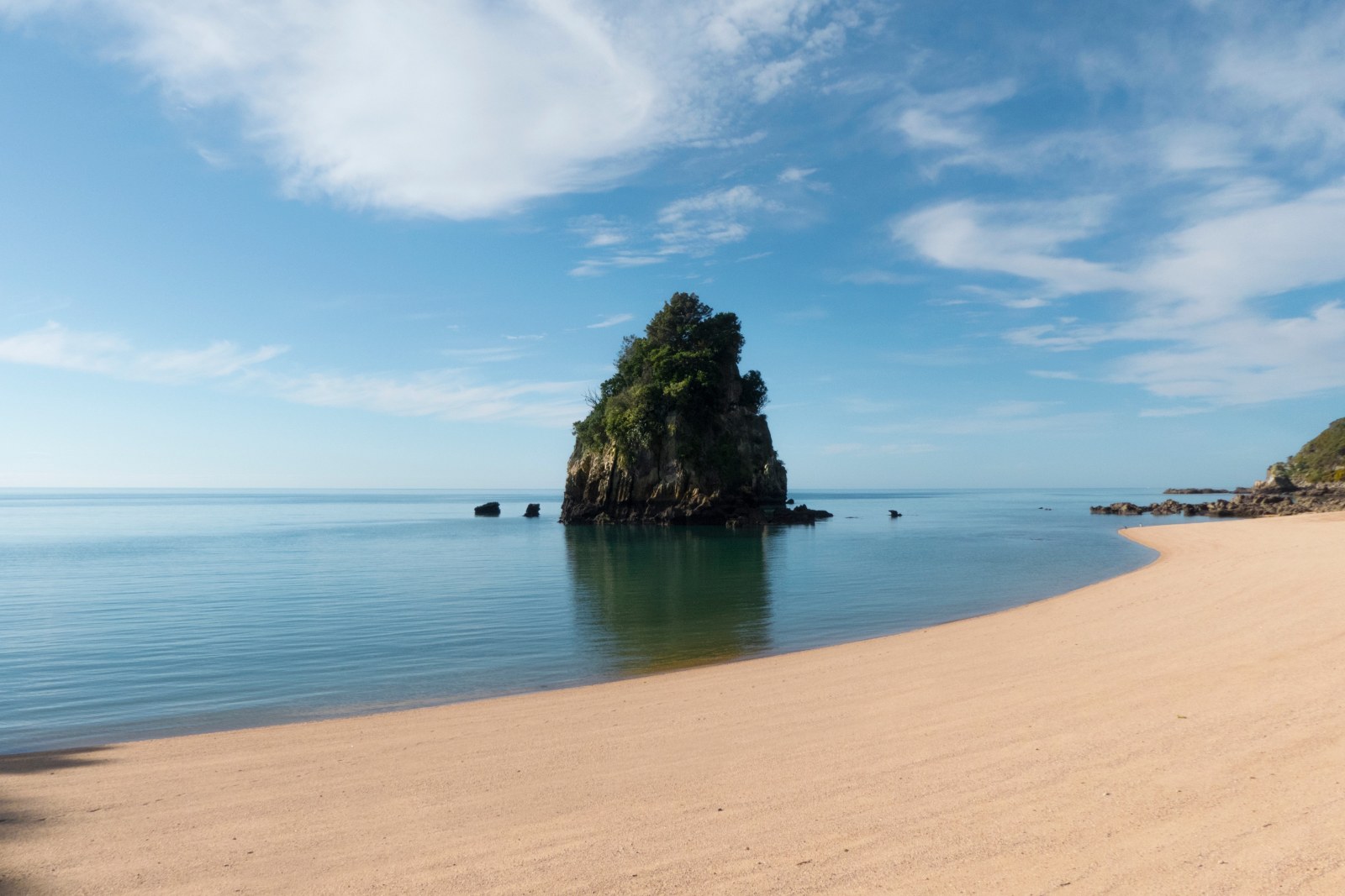 Rock Islet in a Calm Bay — Ocean & Beach wallpaper