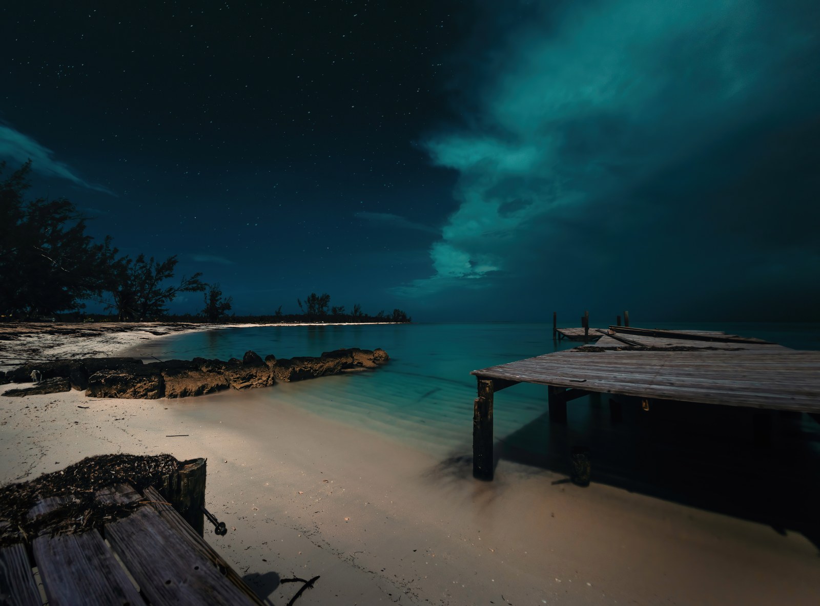 Starry Turquoise Sky Above a Beach Wallpaper — Nature wallpaper