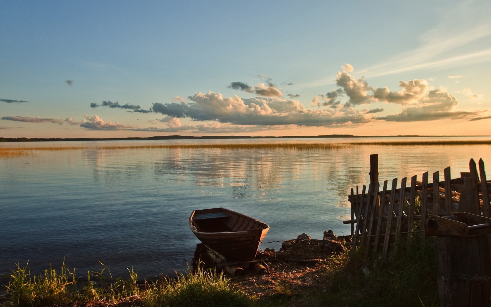 Quiet Lakeside Boat at Sunset Wallpaper — Nature wallpaper
