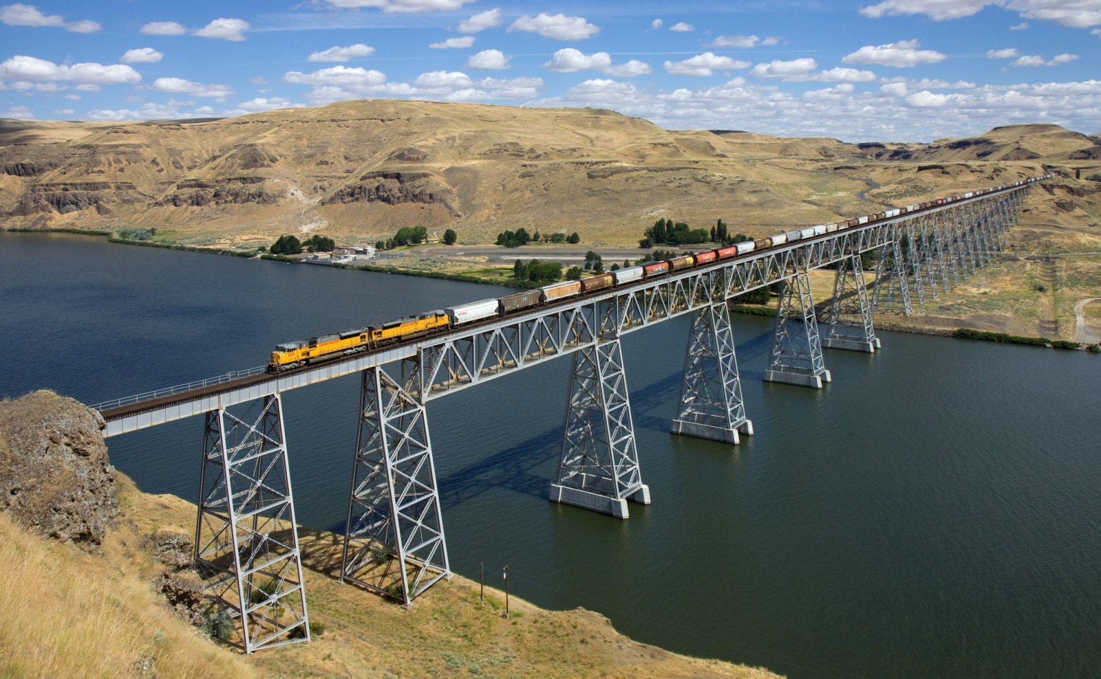 River and Hills in Natural Light — Trains wallpaper