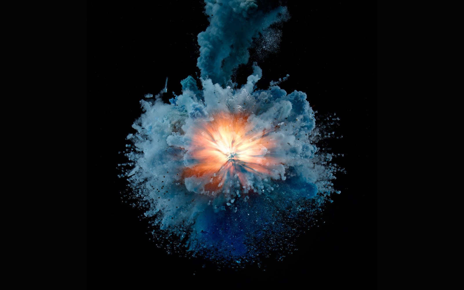 Blue Powder Burst with Glowing Center Wallpaper — Abstract wallpaper
