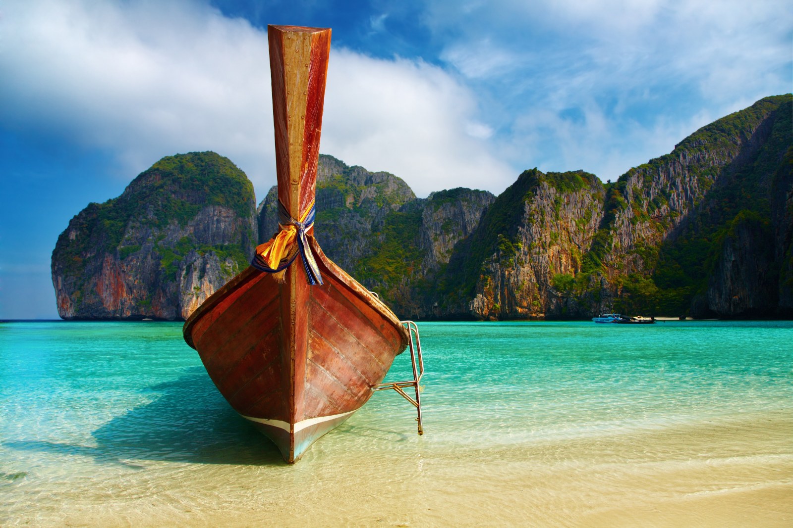 Longtail Boat in a Tropical Bay — Ocean & Beach wallpaper