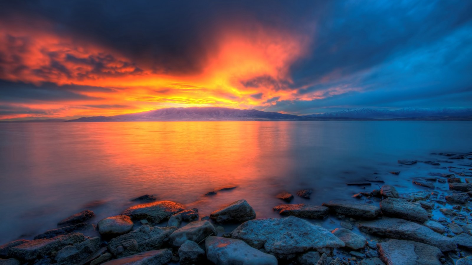 Fiery Sunset Over a Rocky Shore 4K Wallpaper — Nature wallpaper