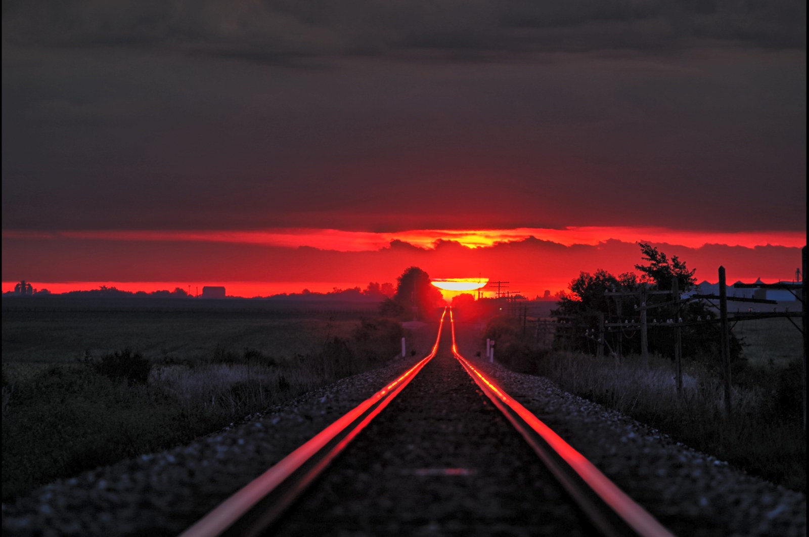 Railway Tracks Leading Toward a Red Sunset Wallpaper — Nature wallpaper