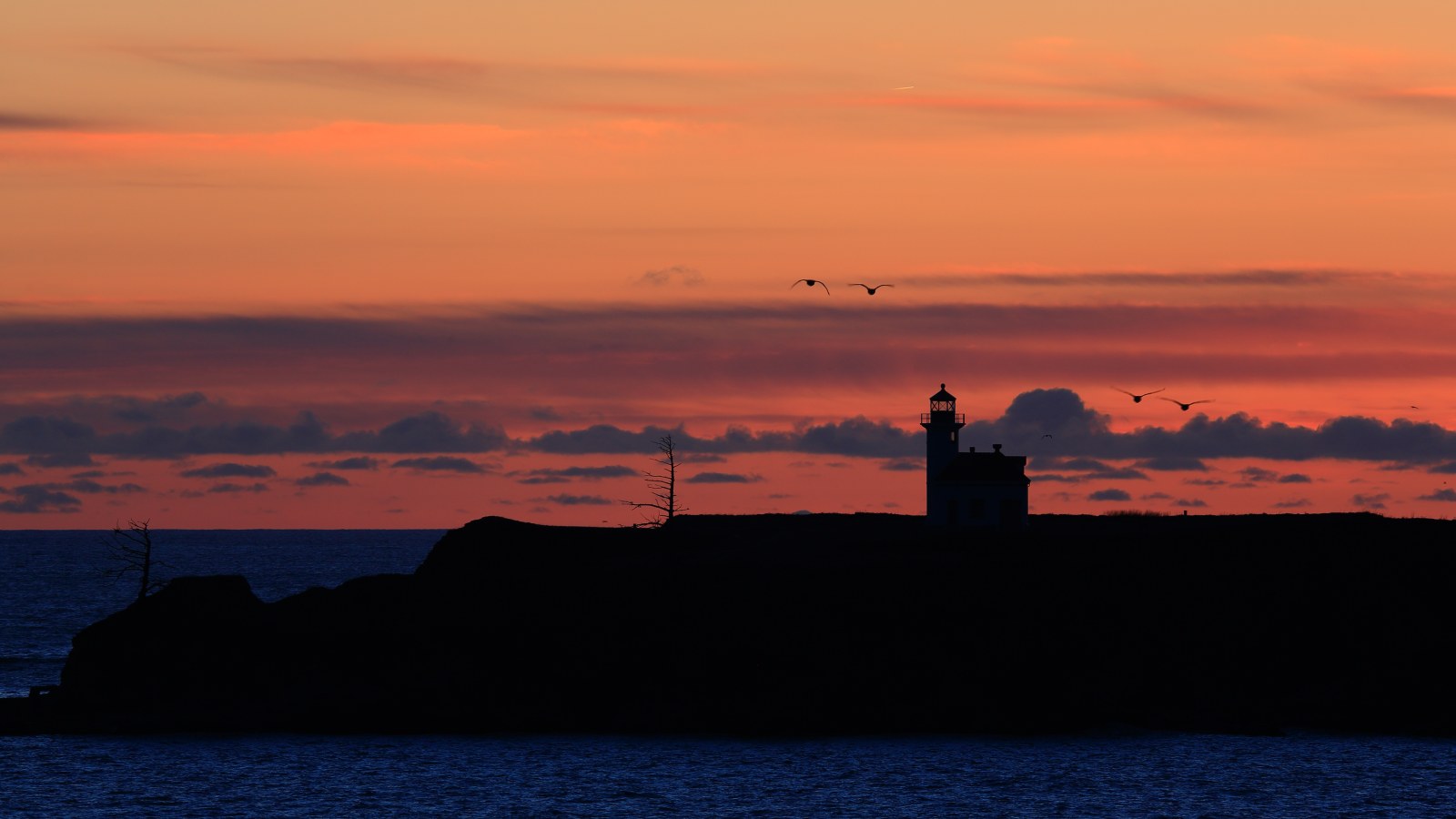 Coastal Lighthouse at Orange Sunset 4K Wallpaper — Nature wallpaper