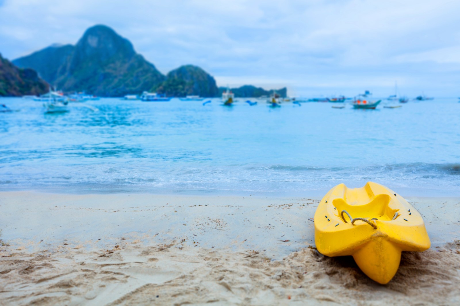 Yellow Kayak on a Calm Beach — Ocean & Beach wallpaper