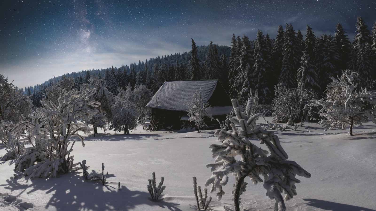 Snow-Covered Cabin in the Forest — Winter wallpaper
