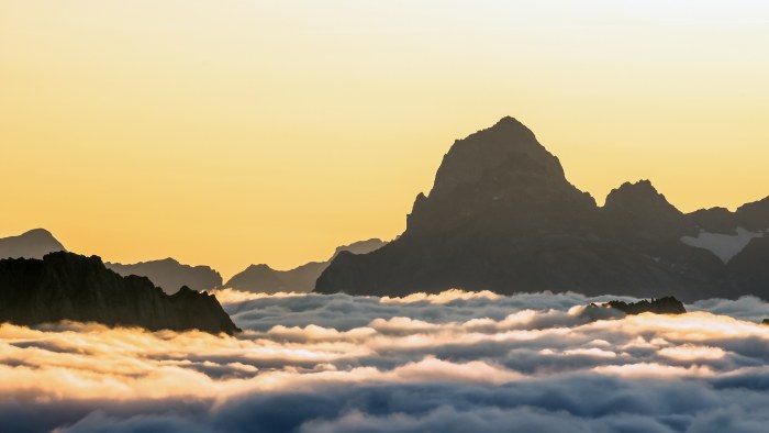 Mountain Peak Above a Sea of Clouds 4K Wallpaper — Nature wallpaper