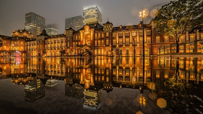 Illuminated Red-Brick Station Reflected at Night — Architecture wallpaper