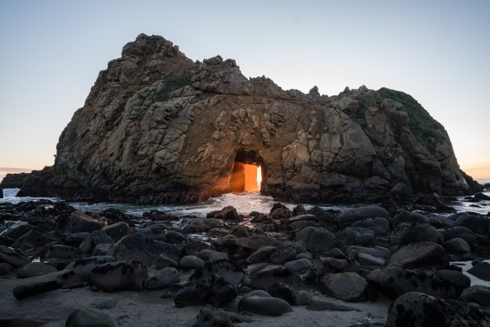 Glowing Rock Shelter on a Coastal Beach Wallpaper — Nature wallpaper