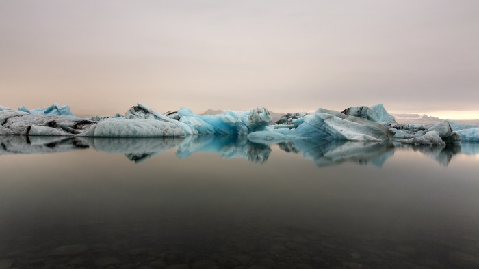 Icebergs Reflected in a Calm Lagoon 4K Wallpaper — Nature wallpaper