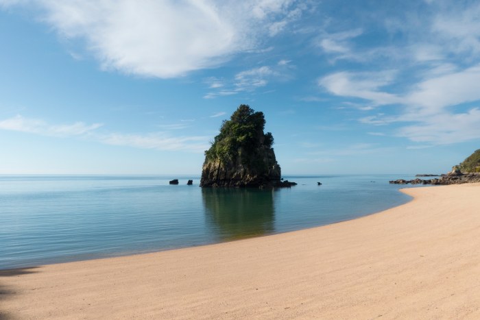 Rock Islet in a Calm Bay — Ocean & Beach wallpaper