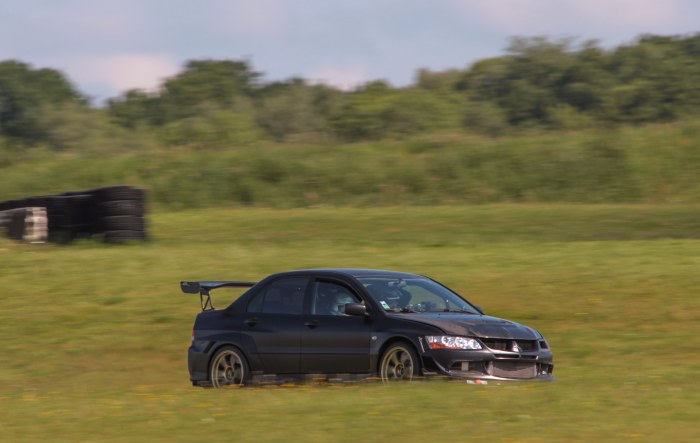 Blue Sedan on a Grassy Field — Cars wallpaper