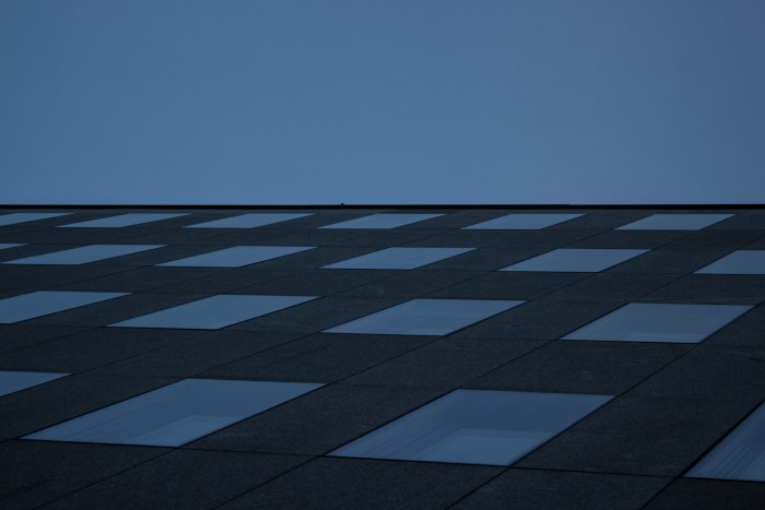 Building Facade Against an Empty Sky — Surreal wallpaper
