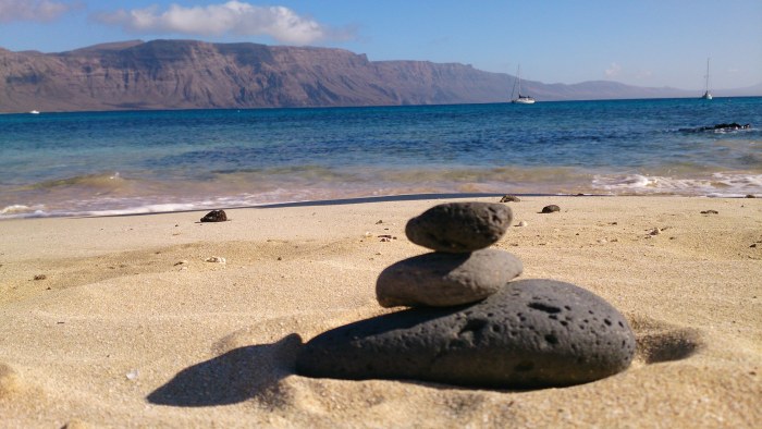 Stone Cairn on a Lanzarote Beach — Ocean & Beach wallpaper