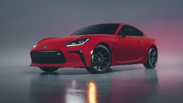 Red Coupe on a Reflective Floor — Cars wallpaper