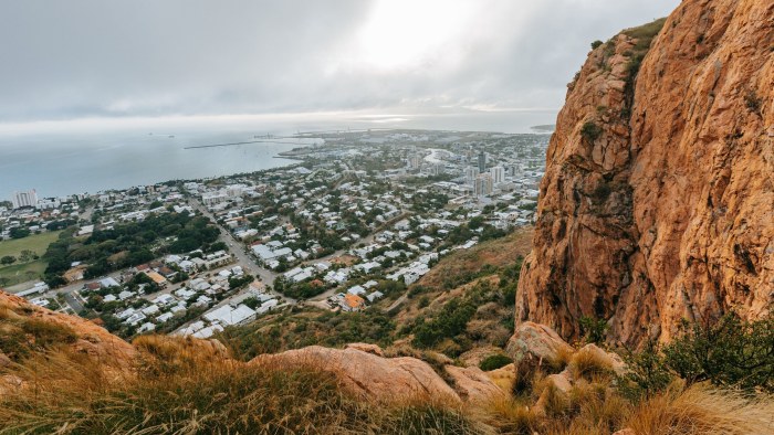 Town Below a Rocky Cliff — Architecture wallpaper