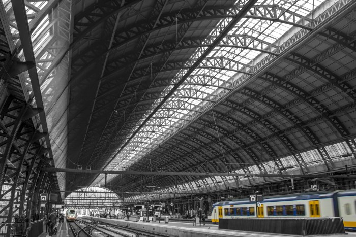 Yellow-Accented Train Beneath a Steel Station Roof — Architecture wallpaper