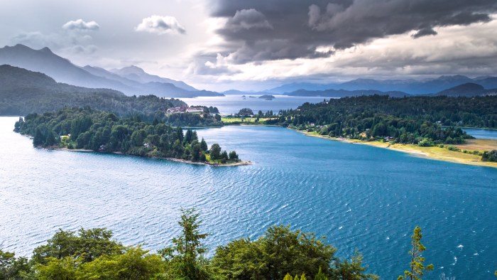 Mountain Lake Beneath Dramatic Clouds 4K Wallpaper — Nature wallpaper