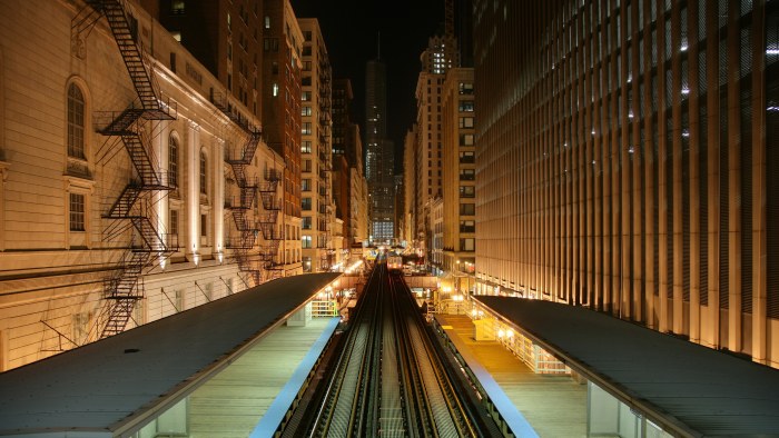Elevated Railway Between City Buildings at Night — Trains wallpaper