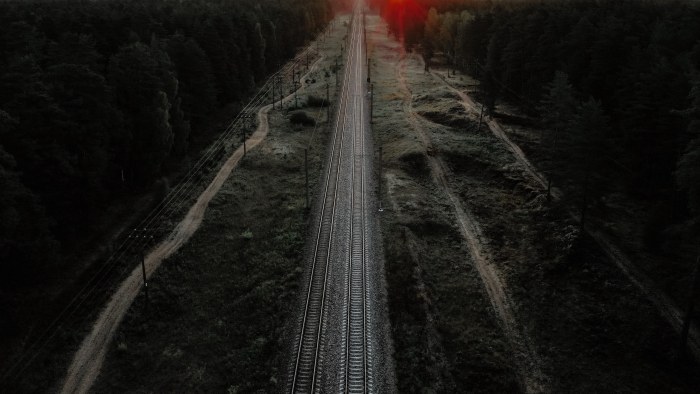 Railway Tracks Through a Forest at Sunset — Trains wallpaper