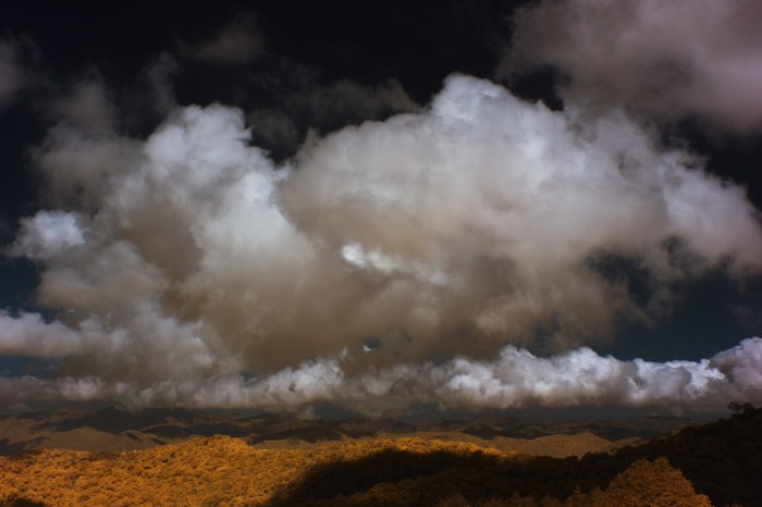Clouds over a Golden Ridge — Surreal wallpaper