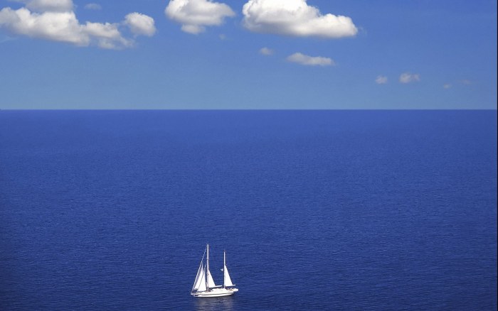 Small Sailboat on a Deep Blue Sea Wallpaper — Minimal wallpaper