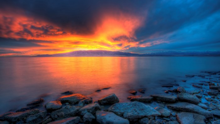 Fiery Sunset Over a Rocky Shore 4K Wallpaper — Nature wallpaper