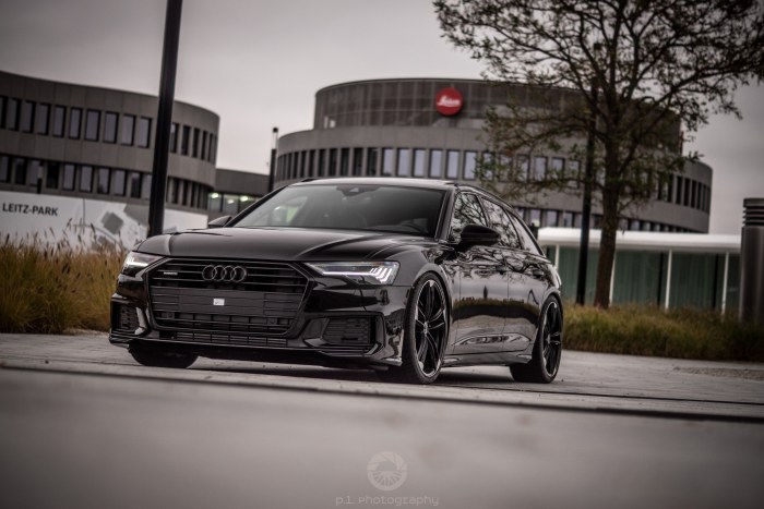 Black Audi Sedan by a Modern Building — Cars wallpaper