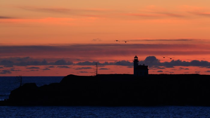Coastal Lighthouse at Orange Sunset 4K Wallpaper — Nature wallpaper