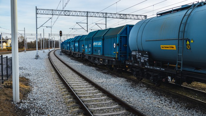 Blue Freight Wagons on Snowy Curved Tracks — Trains wallpaper