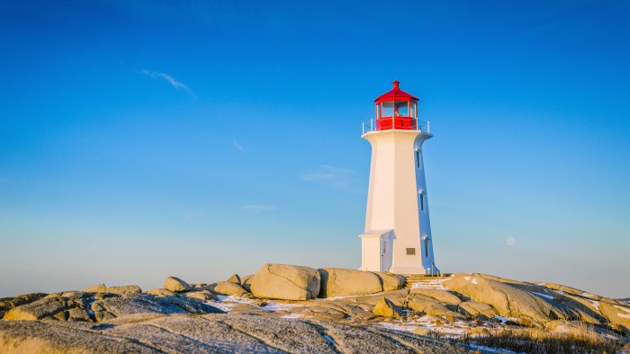 White Lighthouse on Rocky Coast 4K Wallpaper — Nature wallpaper